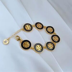 Authentic Tory Burch 18k Gold Plated Hallow Round Black-Gold
Bracelet New W/Tag